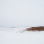 Bare Soil in a Snowy Field 2 by Jereme Rauckman